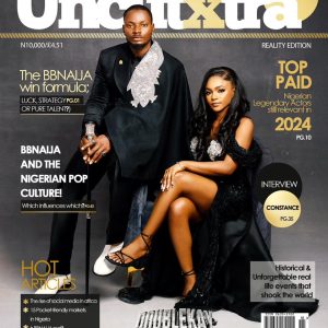 UncutXtra Magazine Volume 18 cover featuring a man and woman dressed formally, seated side by side.