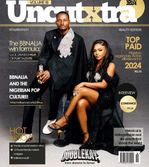 UncutXtra Magazine Volume 18 cover featuring a man and woman dressed formally, seated side by side.