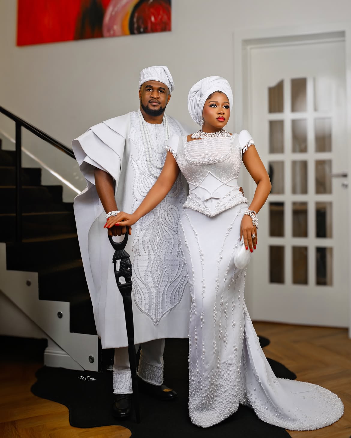 Veekee James and Femi Atere in white outfits at Eliana's dedication