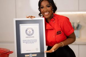 Hilda-Baci-holding-her-Guinness-Record-plaque.jpg