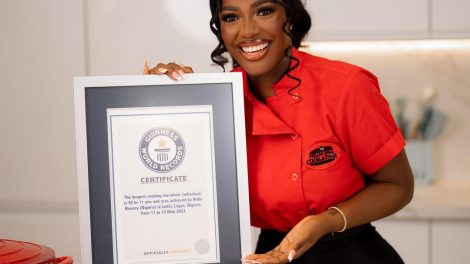 Hilda-Baci-holding-her-Guinness-Record-plaque.jpg