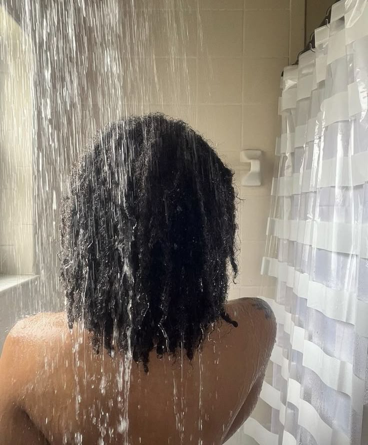 Black woman taking shower personal hygiene routine
