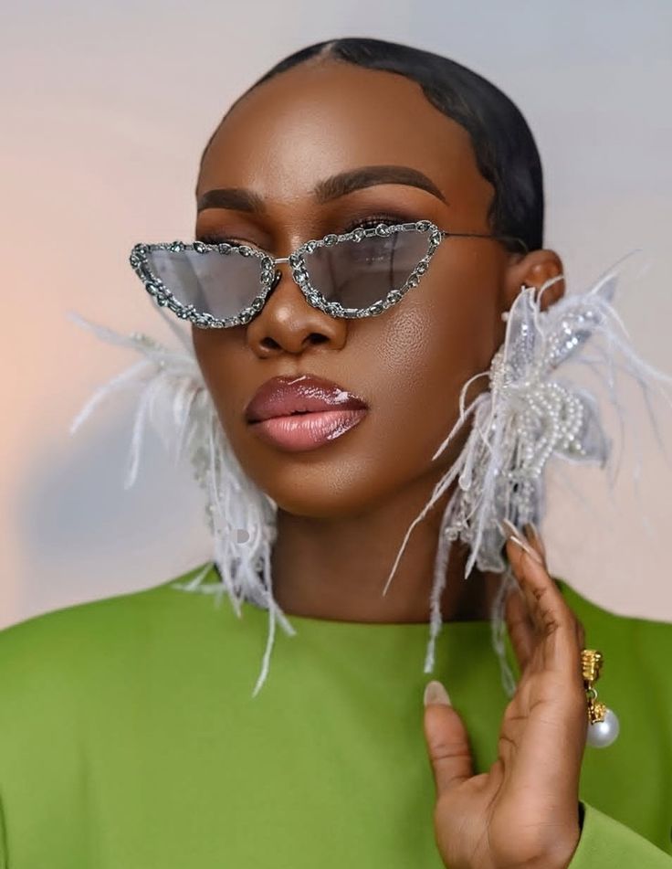 Woman wearing oversized statement sunglasses with a contemporary outfit