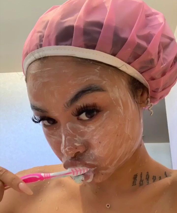 Black woman brushing teeth morning routine