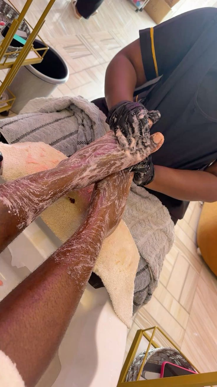Black woman clean nails foot care routine