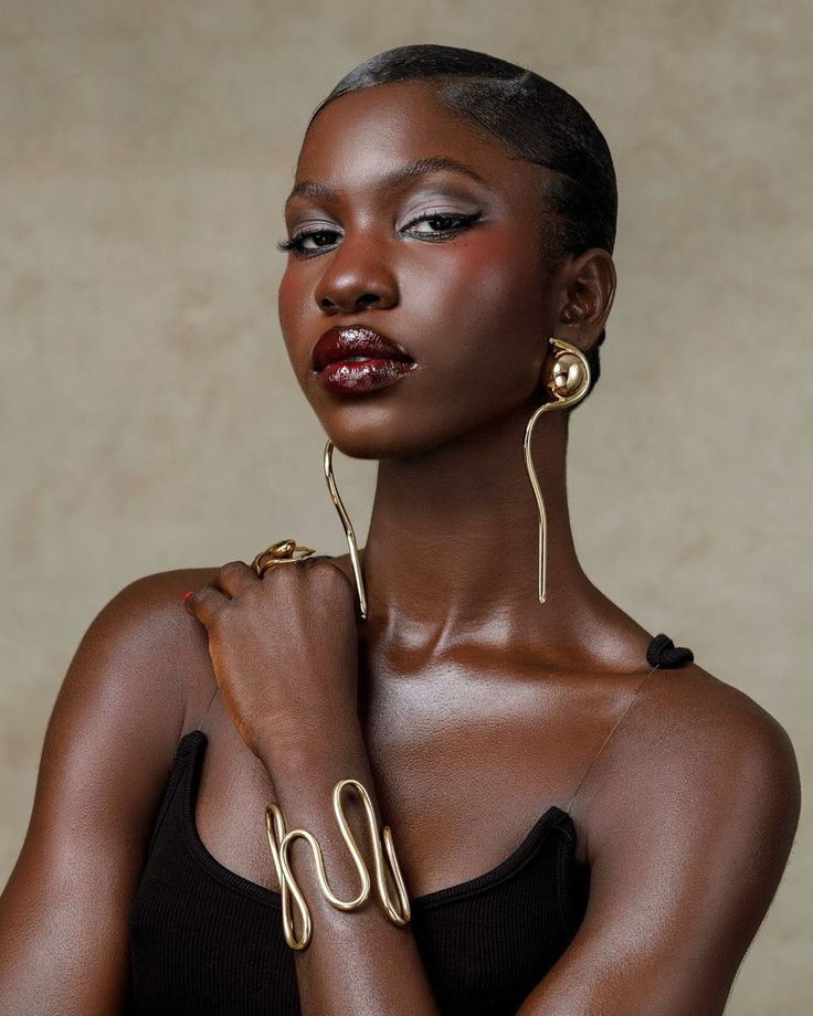 Woman wearing bold statement jewellery with a modern outfit