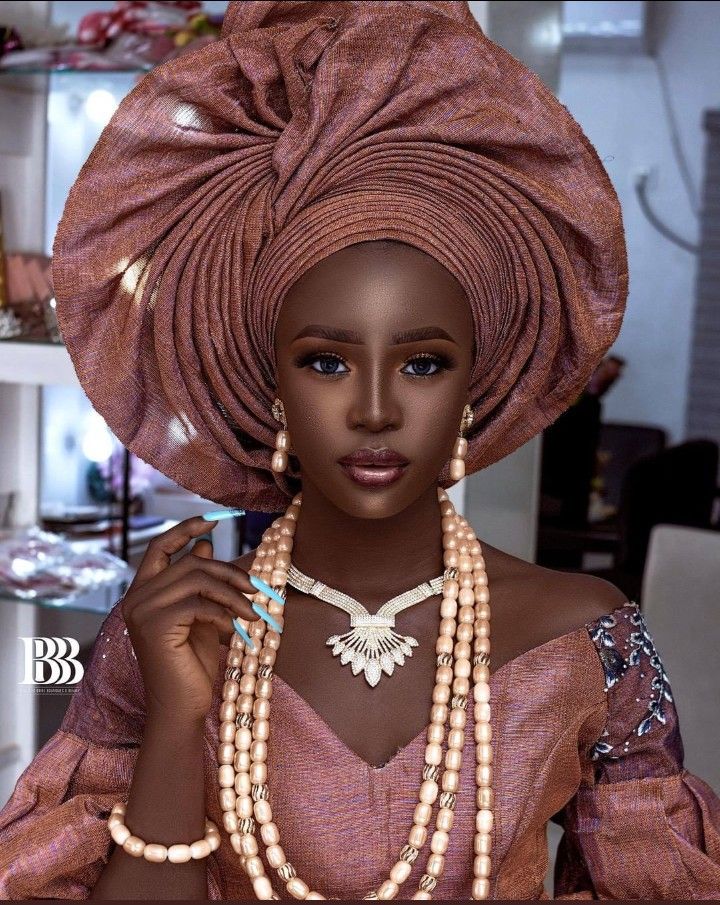 Modern Nigerian fashion styled with coral beads and statement jewellery