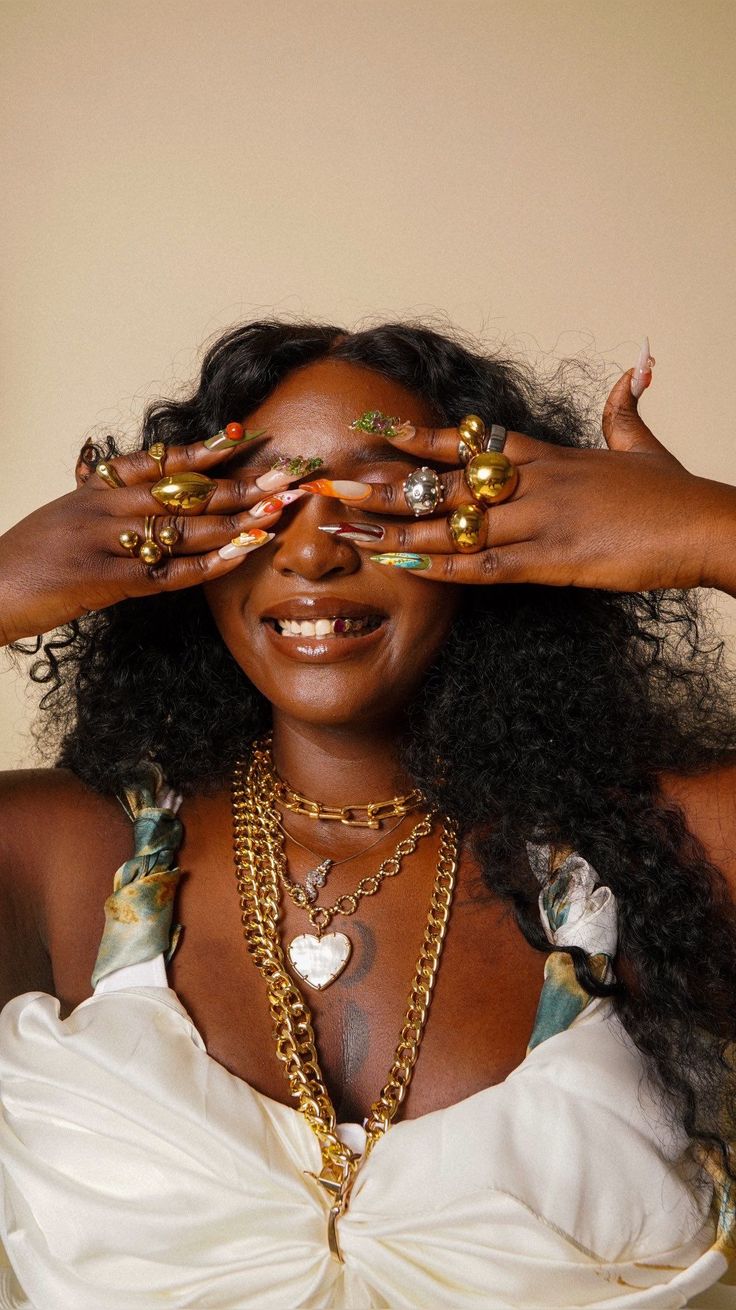 Woman wearing bold statement jewellery with a modern outfit