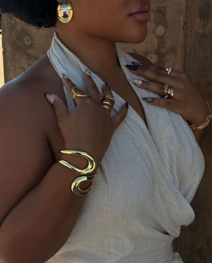Woman wearing statement accessories with a stylish fashion outfit