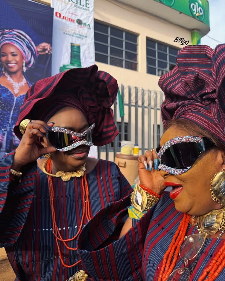 Nigerian fashion look featuring statement sunglasses, Aso-Oke and coral beads