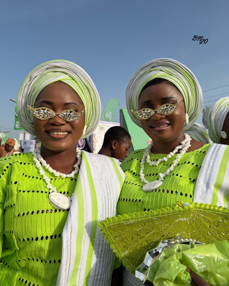 Nigerian fashion look featuring statement sunglasses, Aso-Oke and coral beads