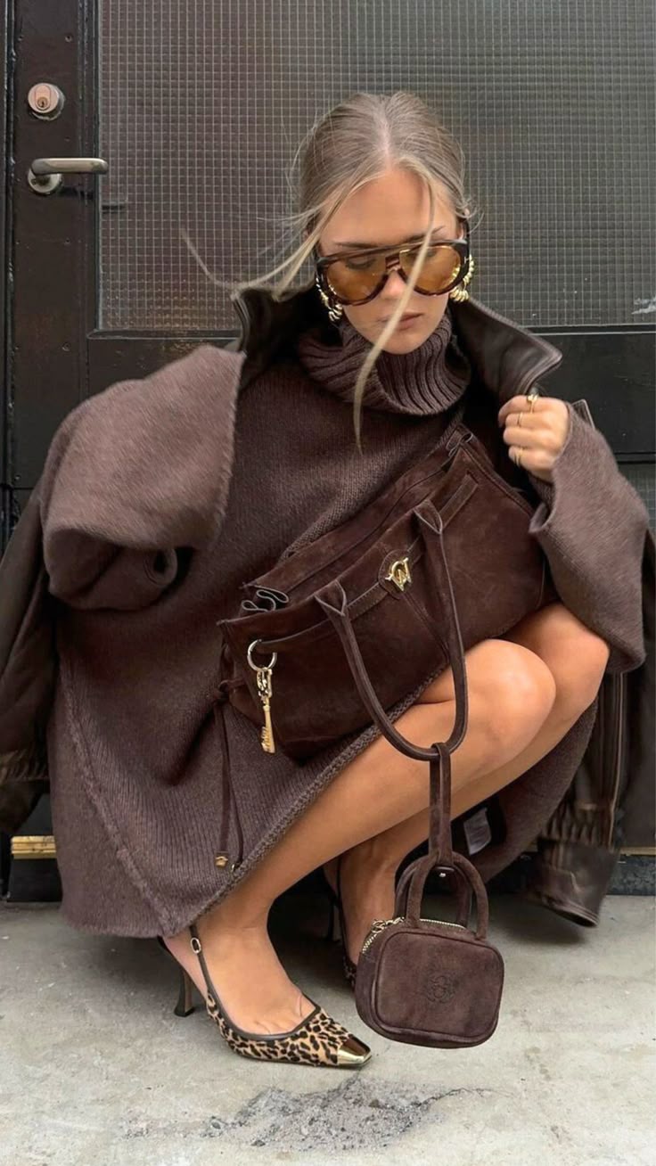 Woman wearing oversized statement sunglasses with a contemporary outfit