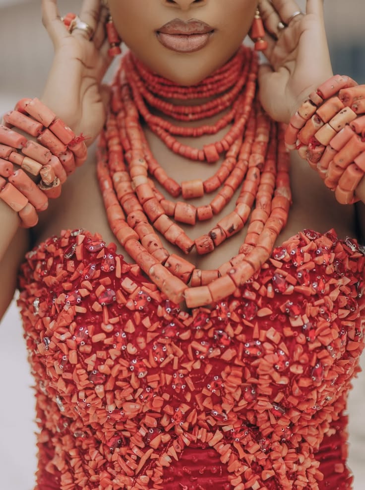 Modern Nigerian fashion styled with coral beads and statement jewellery