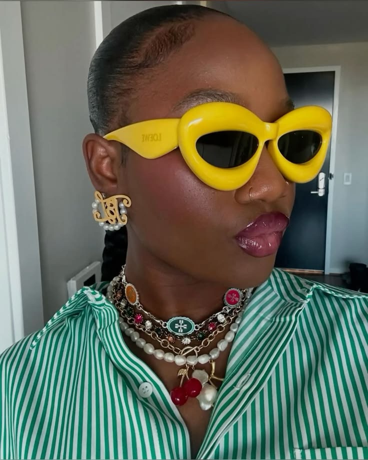 Woman wearing oversized statement sunglasses with a contemporary outfit