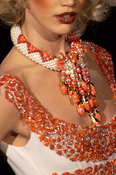 Modern Nigerian fashion styled with coral beads and statement jewellery