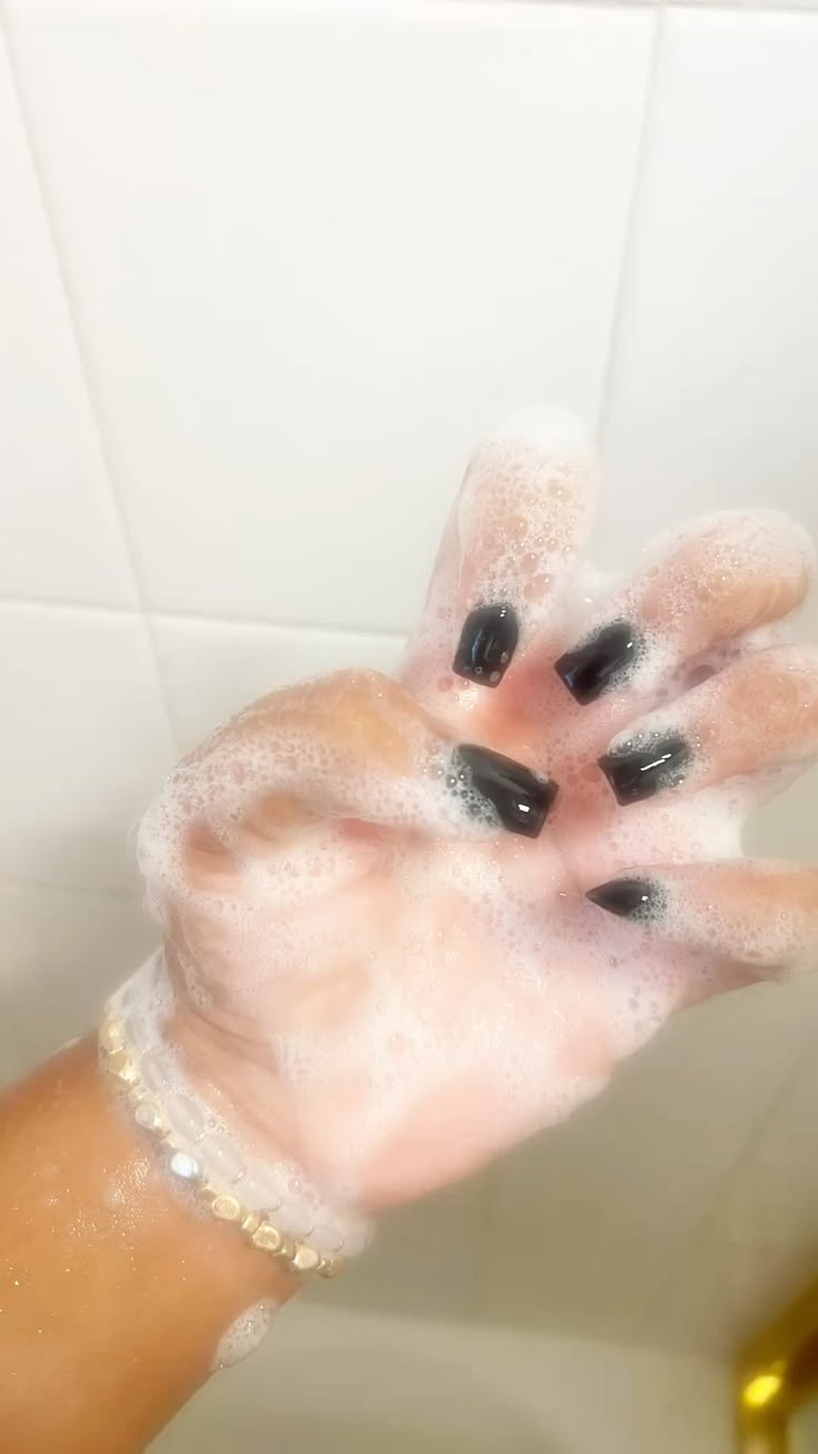 Black woman washing hands soap hygiene