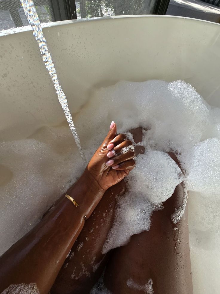 Black woman taking shower personal hygiene routine