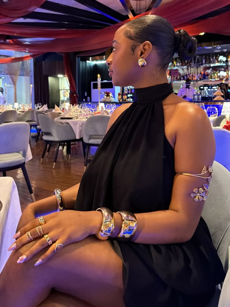 Woman wearing bold statement jewellery with a modern outfit