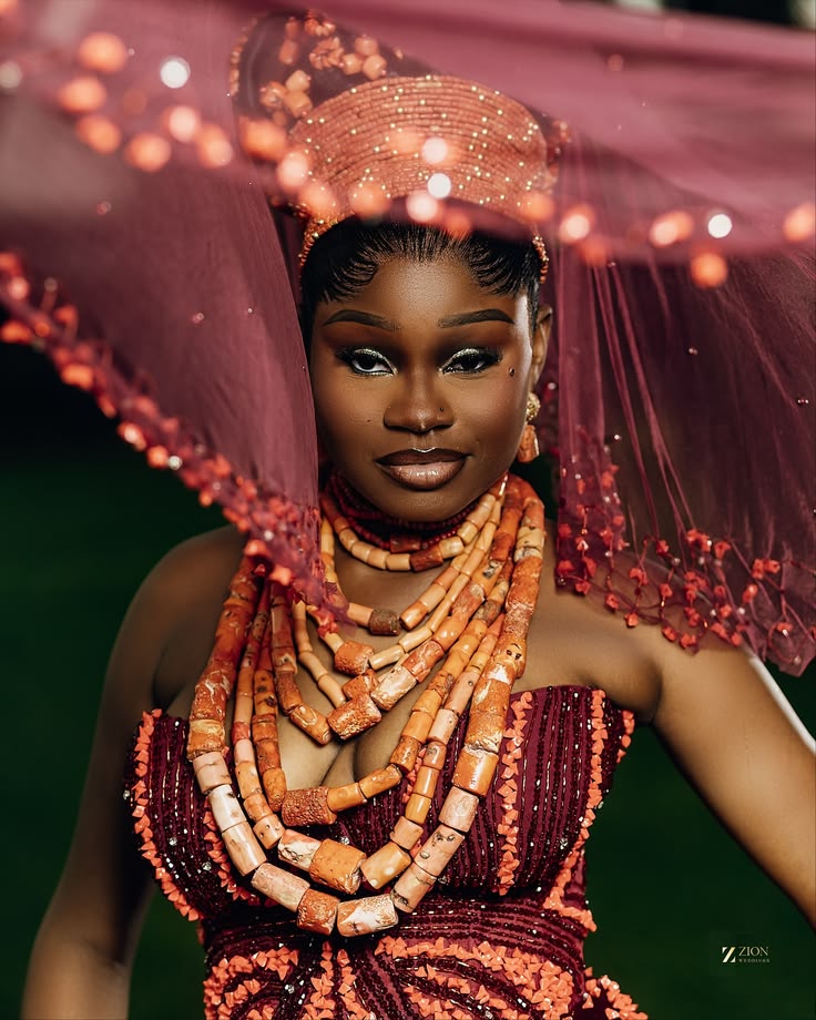 Modern Nigerian fashion styled with coral beads and statement jewellery